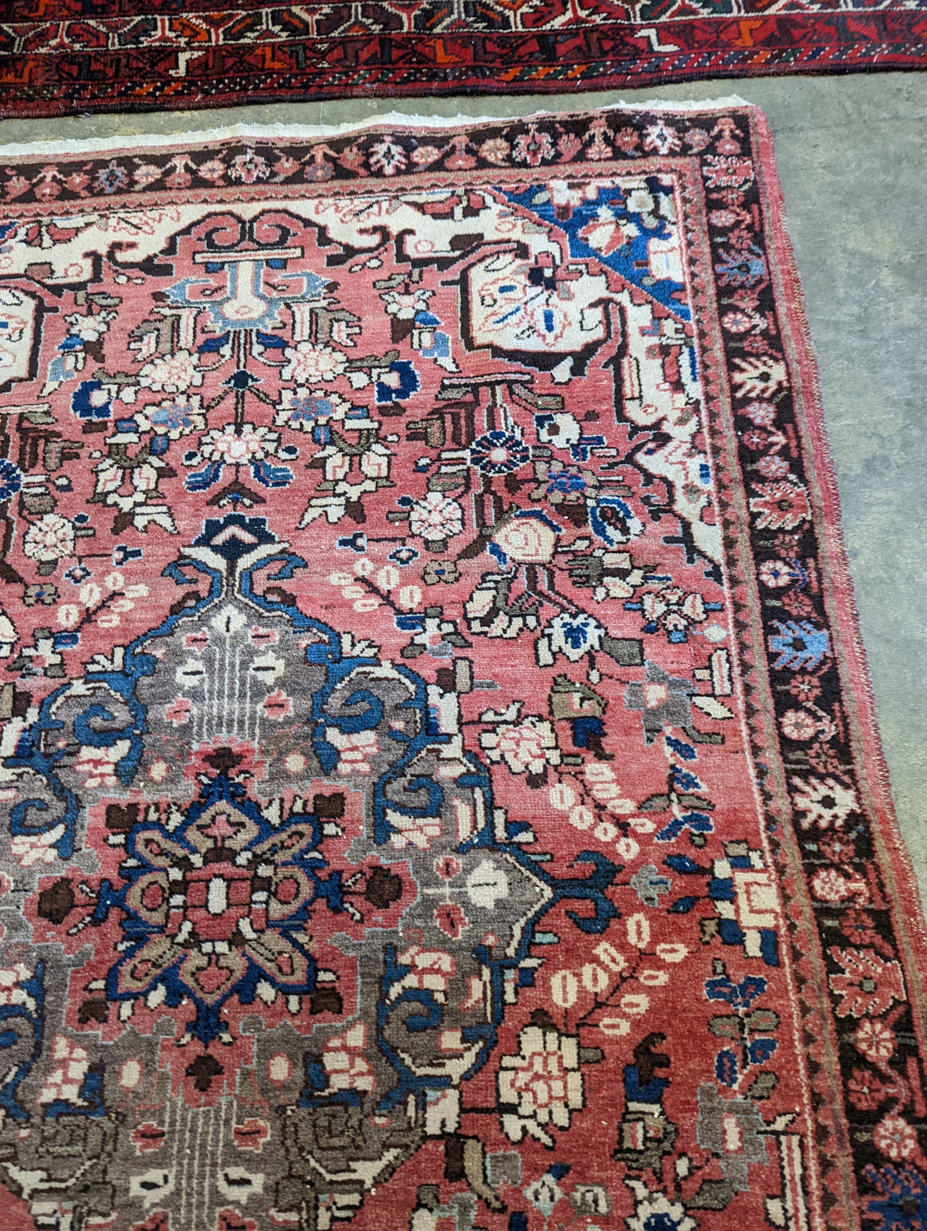 A North West Persian peach ground rug, 240 x 140cm